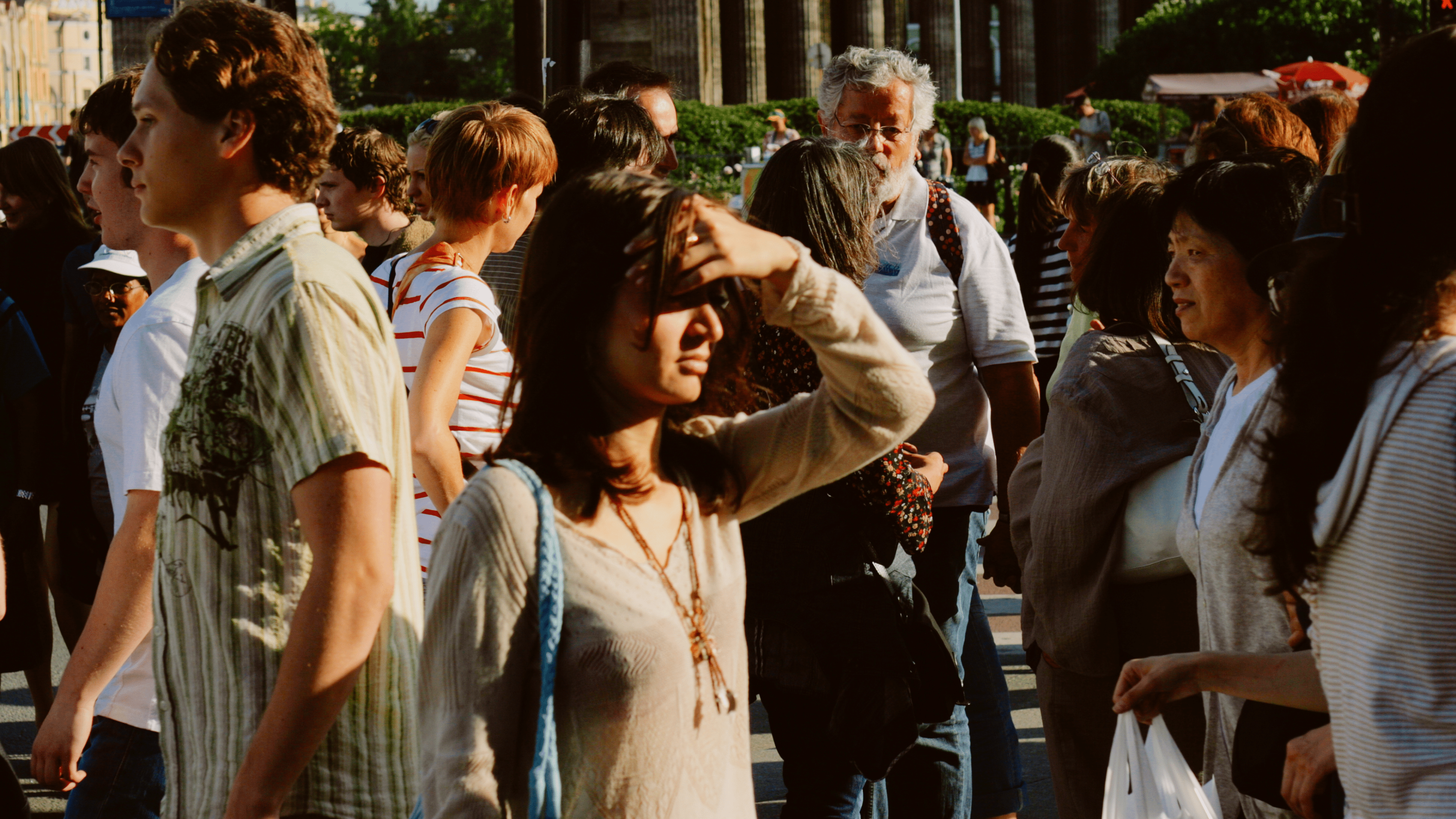 People walking through a public space, illustrating the risks of public identification and loss of anonymity